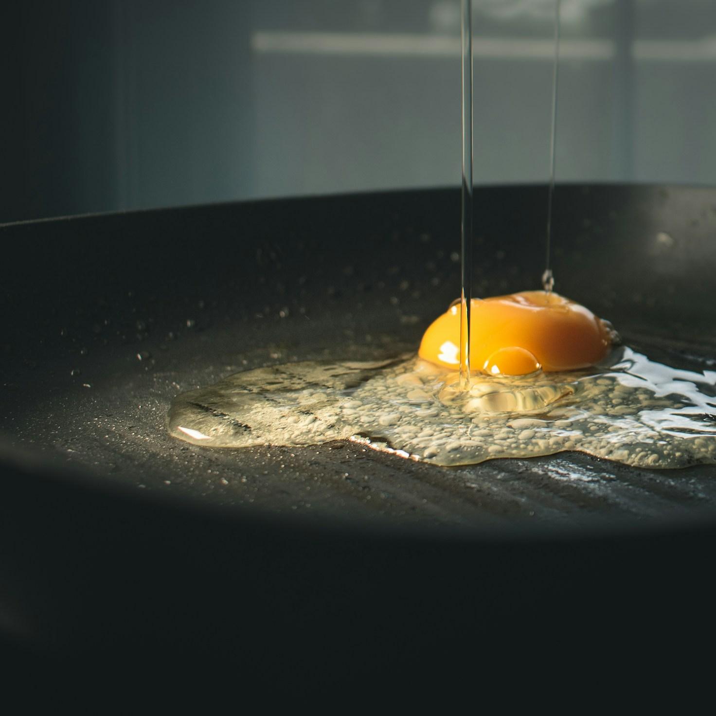 Community members collaborating in a modern kitchen, sharing recipes and techniques